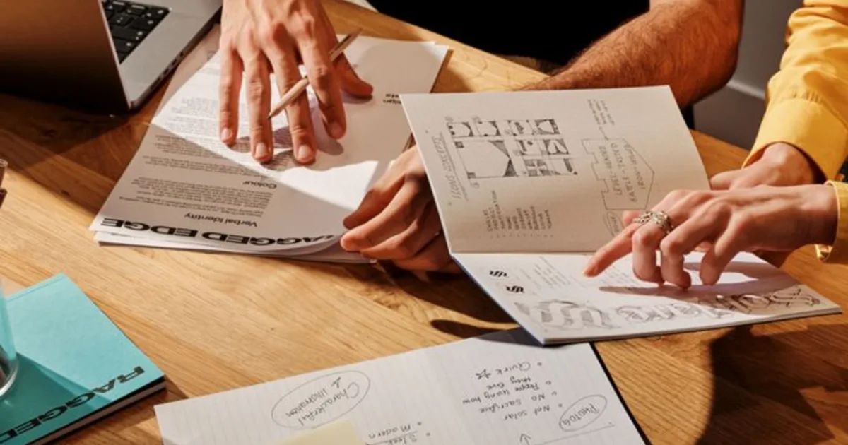 Australian small business owners reviewing AI implementation costs and payback figures