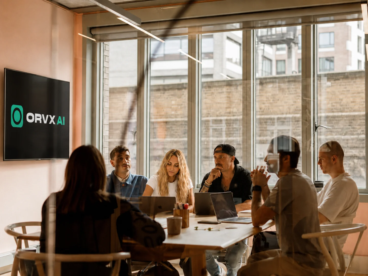 The ORVX AI team in a media buying strategy meeting